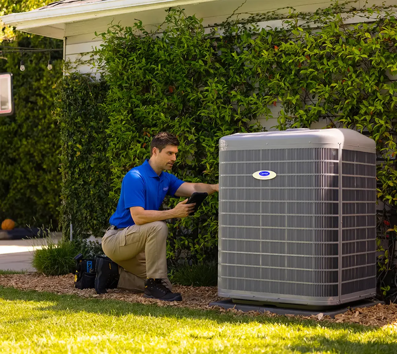 technician installing new air conditioning unit springfield il